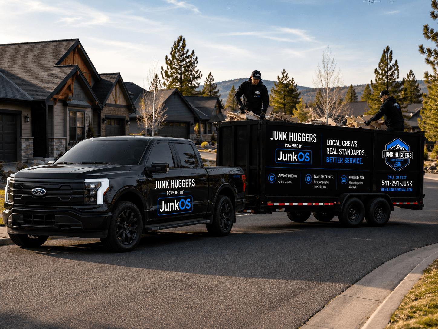 Junk Huggers branded truck and trailer staged in a Bend neighborhood